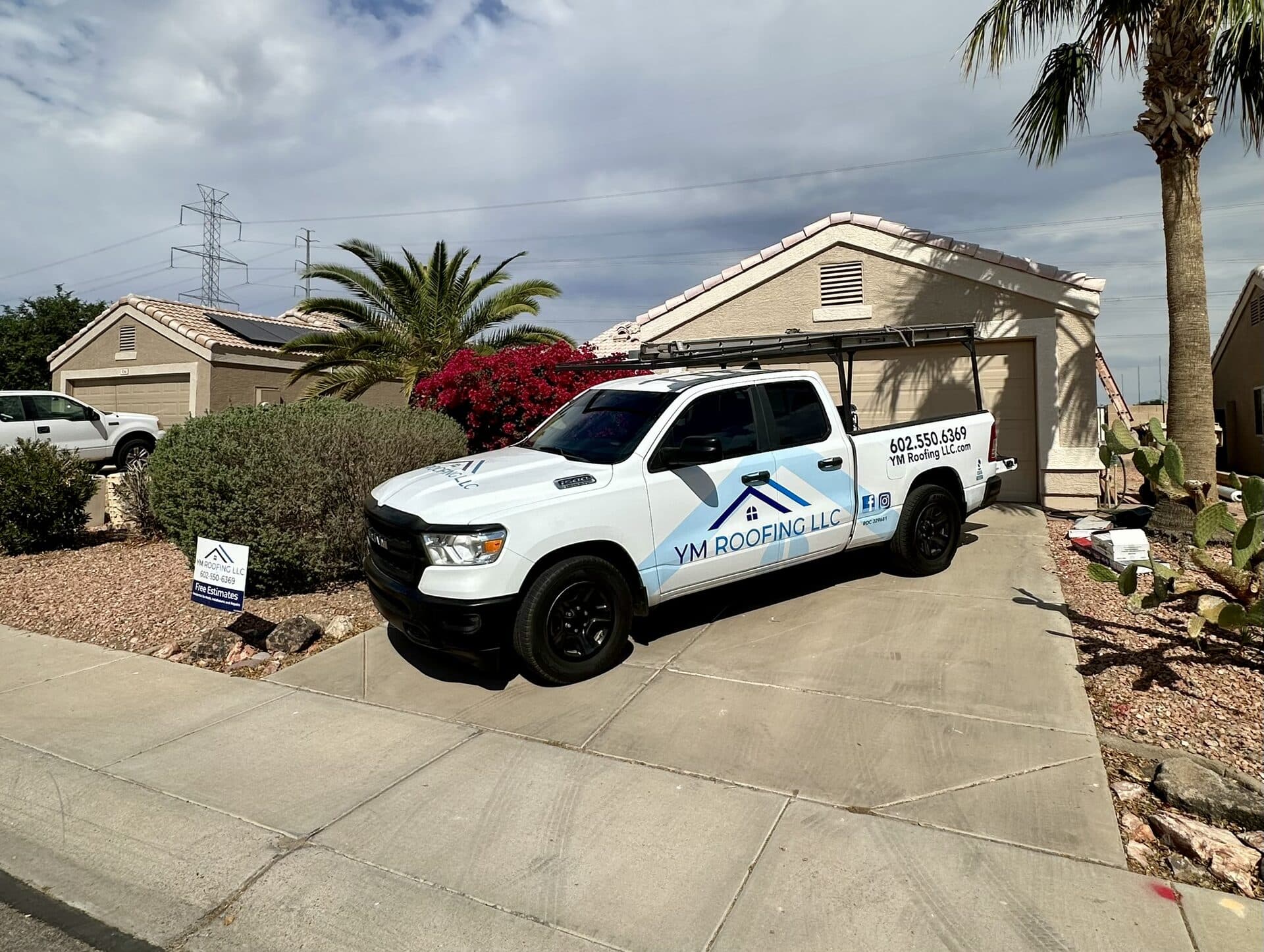 YM Roofing service truck loaded with materials in Goodyear, Arizona